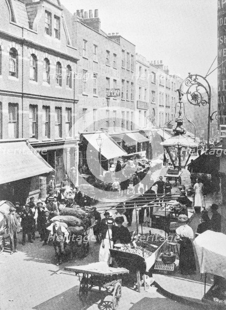 A market in Little Earl Street, looking east, East London. Artist: Unknown