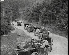 Cars Carrying Italian Troops Driving Through the Alps, 1930s. Creator: British Pathe Ltd.