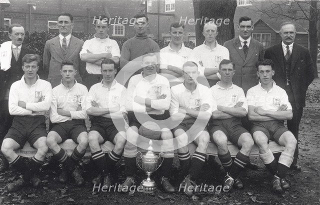 Rowntree football team pose with cup, 1936. Artist: Unknown
