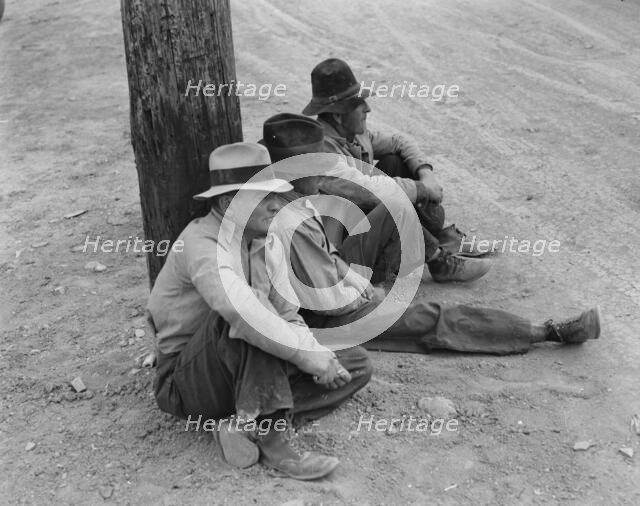 Waiting for the semi-monthly relief checks at Calipatria, California, 1937. Creator: Dorothea Lange.