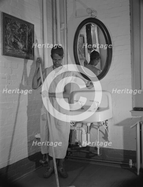 Government charwoman who provides for a family of six on her salary..., Washington, D.C., 1942. Creator: Gordon Parks.