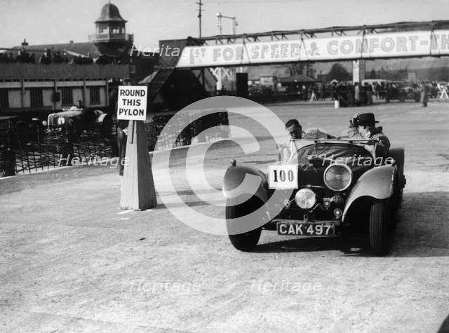 1938 S.S. 100 at Brooklands suring Junior Car Club event 25th March 1939 Artist: Unknown.