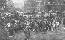 'Ils S'en Vont; Unrassemblement allemand sur la place Saint-Lambert, a Liege; au fond..., 1918. Creator: Unknown.
