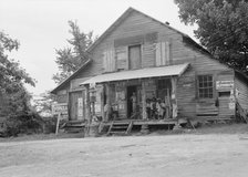 Country store on dirt road, Sunday afternoon, near Gordenton, North Carolina, 1939. Creator: Dorothea Lange.