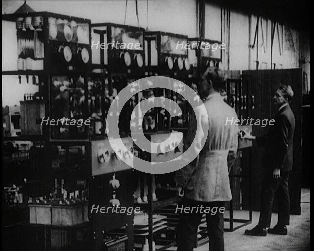 Engineers Observing Valves and Turning Pressure Dials, 1922. Creator: British Pathe Ltd.