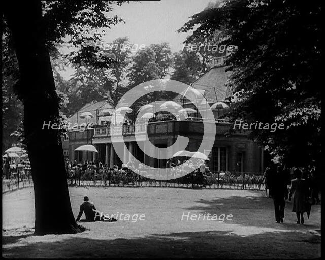 People Walking and Relaxing in the Park, 1933. Creator: British Pathe Ltd.