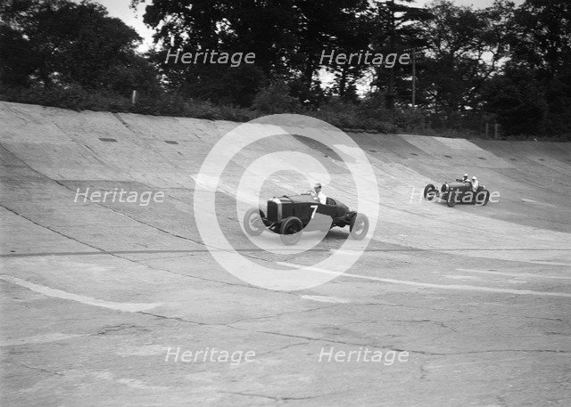 Vauxhall 30/98 and Bugatti Type 37 racing on the banking at Brooklands. Artist: Bill Brunell.