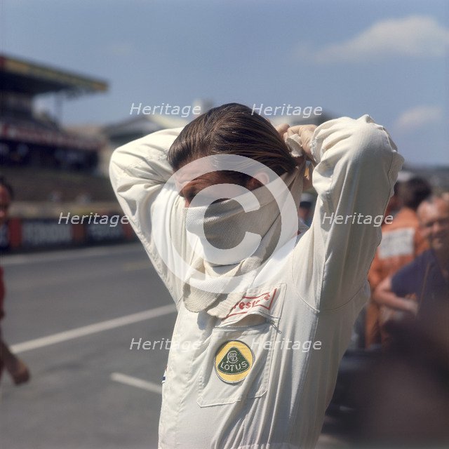 Graham Hill getting ready for the French Grand Prix, Le Mans, France, 1967. Artist: Unknown