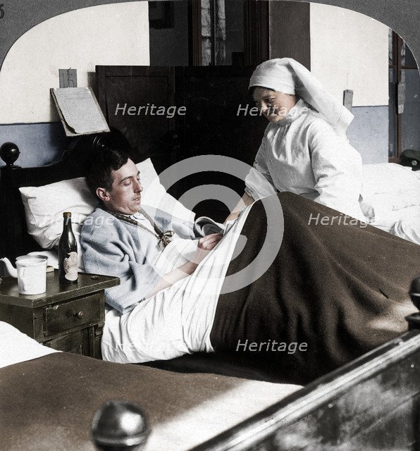 A soldier writing a letter in hospital, World War I, 1914-1918. Artist: Realistic Travels Publishers.