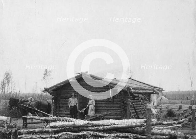 Homesteaders and their home, between c1900 and c1930. Creator: Unknown.