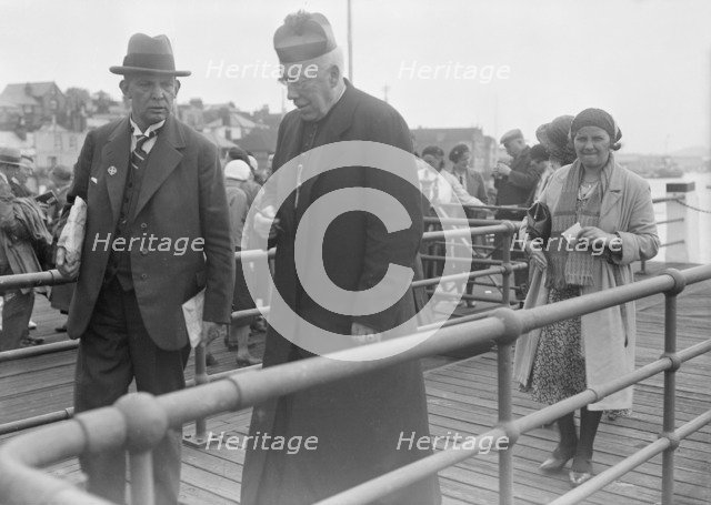Catholic priest, c1935. Creator: Kirk & Sons of Cowes.
