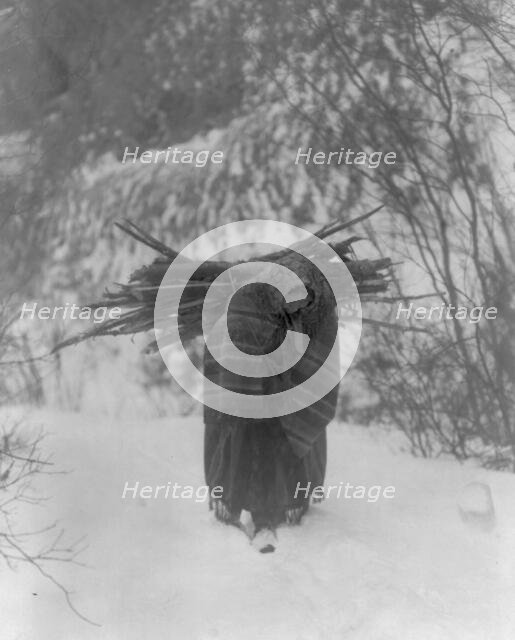 A heavy load, c1908. Creator: Edward Sheriff Curtis.