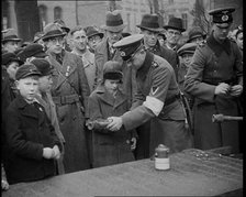 Child Holding a Hand Grenade, 1930s. Creator: British Pathe Ltd.