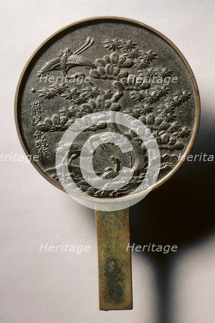 Mirror with Handle, Decorated with Pine Tree and Crane, early 17th - mid 19th century. Creator: Unknown.