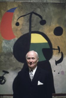 Joan Miró (1893-1983), Spanish Painter, pictured with one of his works.