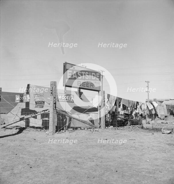 Living conditions for migratory laborers in private auto camp, Calipatria, Imperial County, 1939. Creator: Dorothea Lange.