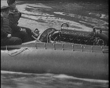 Marion Barbara 'Joe' Carstairs on a Speedboat with a Male Civilian Passenger, 1920. Creator: British Pathe Ltd.