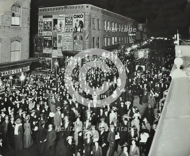 Crowds of shoppers in Rye Lane at night, Peckham, London, 1913. Artist: Unknown.