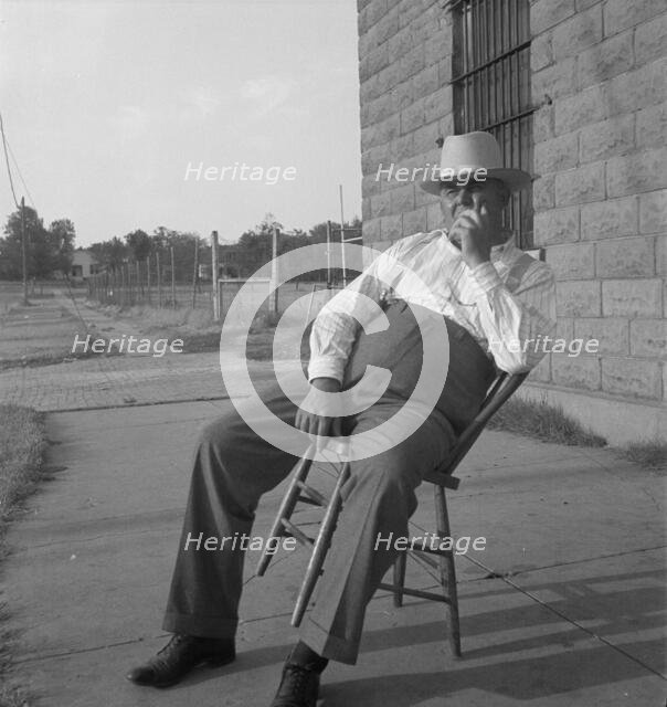 The sheriff of McAlester, Oklahoma, sitting in front of the jail, 1936. Creator: Dorothea Lange.