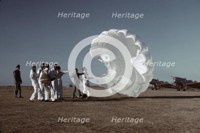 Instructor explaining the operation of a parachute to student pilots, Fort Worth, Tex., 1942. Creator: Arthur Rothstein.
