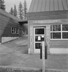 Post office in company lumber town, Gilchrist, Oregon, 1939. Creator: Dorothea Lange.