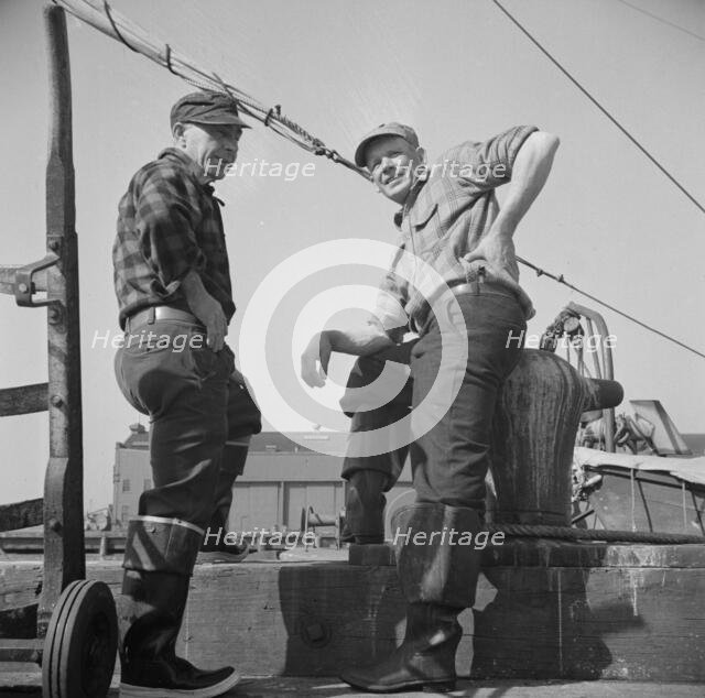 New England fishermen resting on the Fulton docks, New York, 1943. Creator: Gordon Parks.