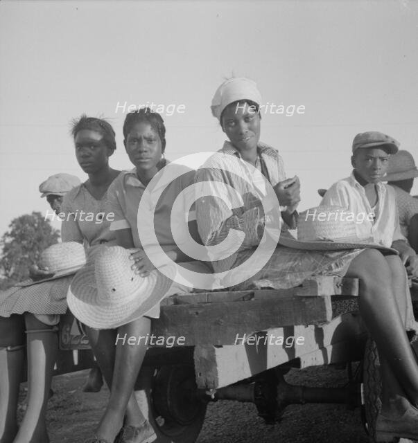 Women being transported from Memphis, Tennessee to an Arkansas plantation, 1937. Creator: Dorothea Lange.