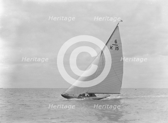 The 6 Metre class 'Alarm' (K15) heeling upwind, 1921. Creator: Kirk & Sons of Cowes.