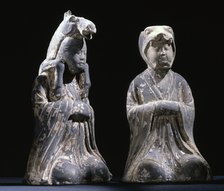Two grey pottery male kneeling figures representing animals of the zodiac, Chinese, c396 AD. Artist: Werner Forman