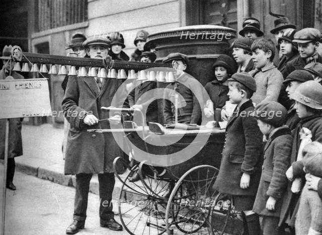 A bell busker, London, 1926-1927.Artist: McLeish