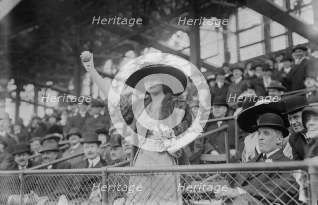 Miss Genevieve Ebbets, youngest daughter of Charley Ebbets, throws first ball at opening..., 1913. Creator: Bain News Service.