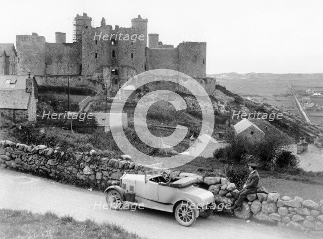 A Singer car in front of Harlech Castle, Wales, early 1920s. Artist: Unknown