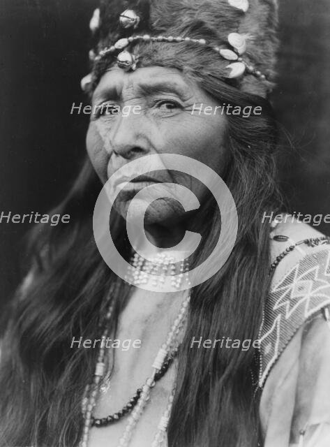 Klamath woman, head-and-shoulders portrait, facing left, c1923. Creator: Edward Sheriff Curtis.