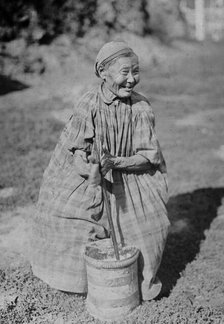 Butter churning, 1890. Creator: Unknown.