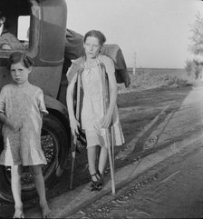 Children of Oklahoma drought refugees on highway near Bakersfield, California, 1935. Creator: Dorothea Lange.