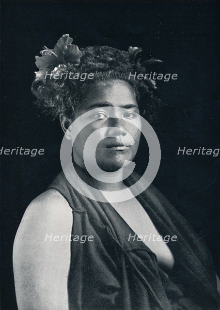 A Tongan woman, with scarlet hibiscus blossoms in her hair, 1902. Artist: JJ Lister.