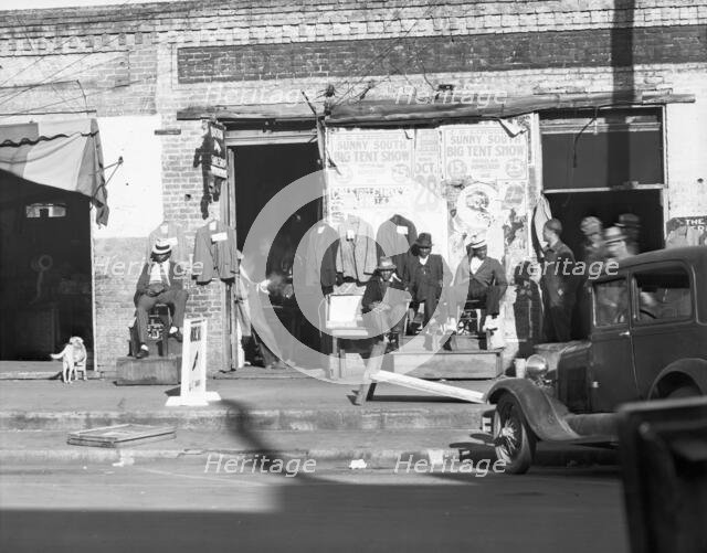 Sidewalk scene in Selma, Alabama, 1935. Creator: Walker Evans.