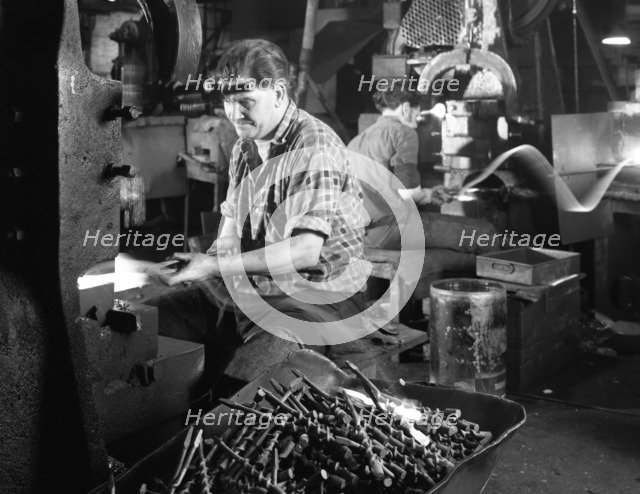 A spring hammer turning drill bits, Footprint Tools, Sheffield, South Yorkshire, 1968. Artist: Michael Walters