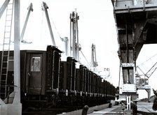 Loading and transport of train wagons in the port of Zeebrugge - Bruges, Belgium.