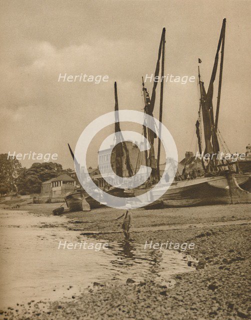 'Barges Aground At Mortlake With The Tide at Full Ebb', c1935. Creator: Donald McLeish.