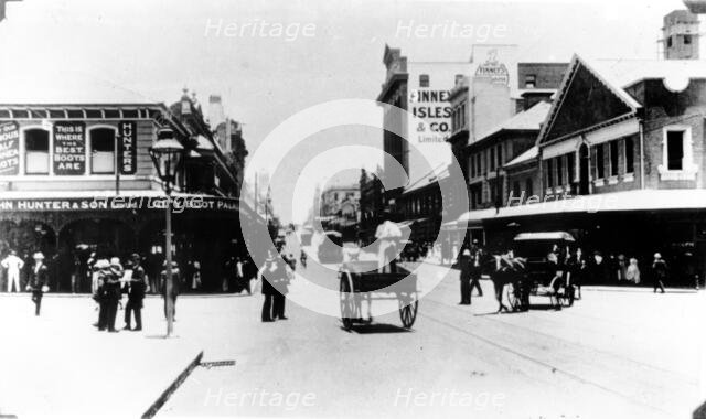 Policeman directs traffic at the intersection of Queen and Edward St, Brisbane, Queensland, c1908. Creator: Unknown.