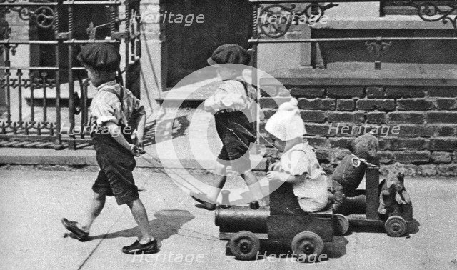 Young children playing in the street, London, 1926-1927. Artist: Unknown