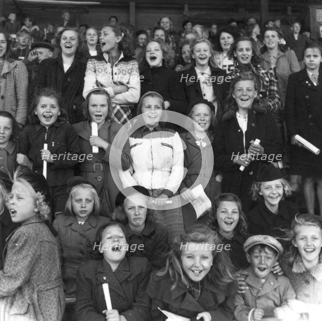 Supporters at a school sports match, Trelleborg, Sweden, 1950. Artist: Unknown