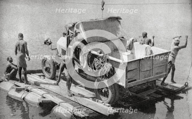 Crossing the Chambesi River on a broken pontoon, Northern Rhodesia, 1925 (1927). Artist: Thomas A Glover