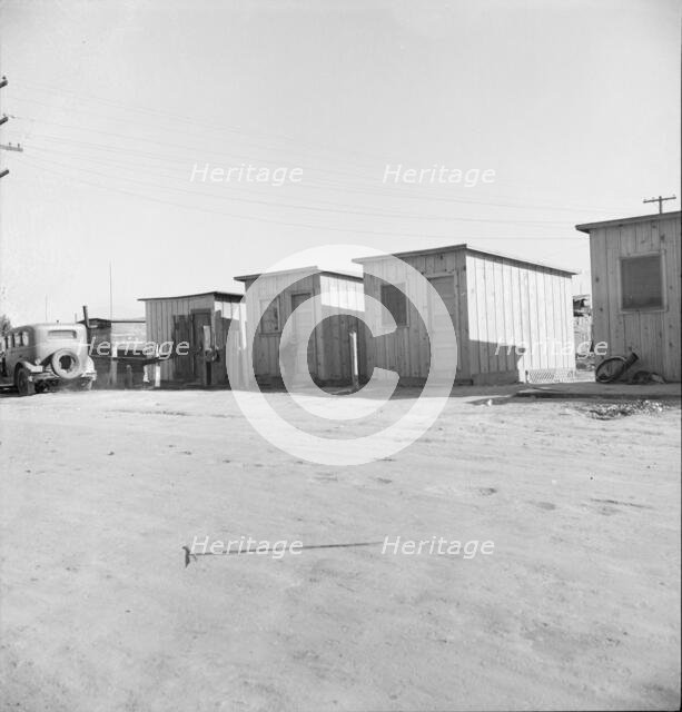 Newly-built cabins, rent five dollars per month, near Bakersfield, California , 1939. Creator: Dorothea Lange.