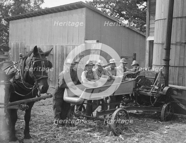 Seven of the eight farmers shown with their cooperatively owned...Yamhill County, Oregon, 1939. Creator: Dorothea Lange.