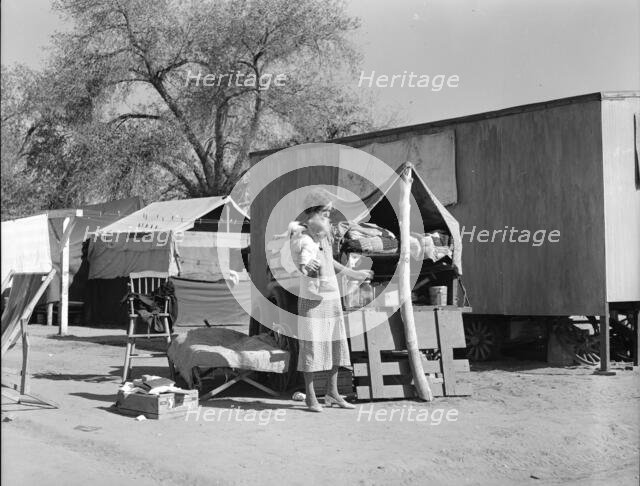 Tubercular mother from Oklahoma now living in the Kern migrant camp (resettlement), CA, 1936. Creator: Dorothea Lange.