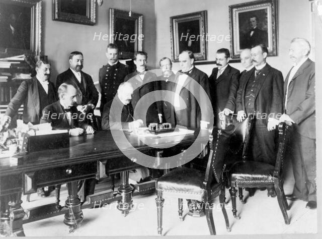 Ambassador Cambon signing the Peace Protocol, c1898. Creator: Frances Benjamin Johnston.