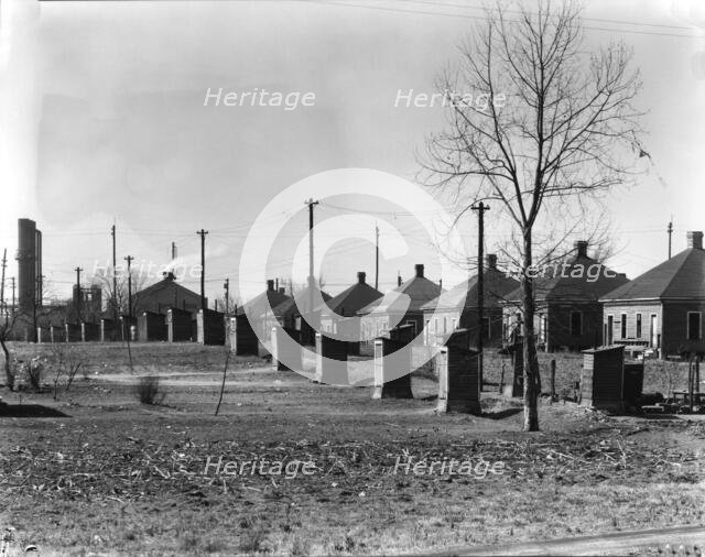 Steelmill workers' company houses and outhouses, Republic Steel Company, Birmingham, Alabama, 1936. Creator: Walker Evans.