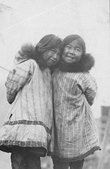 Two Eskimo girls standing side by side, between c1900 and c1930. Creator: Unknown.
